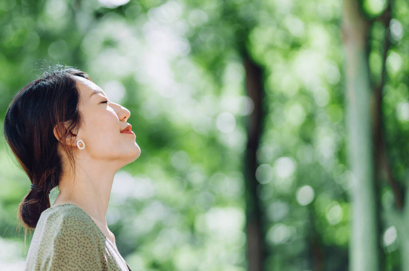 Woman smiling and meditating