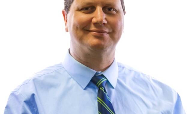 man in blue shirt and tie