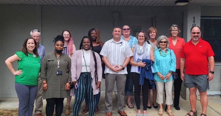 Group photo of Lakeview Center and Central Church Pensacola Beach representatives.