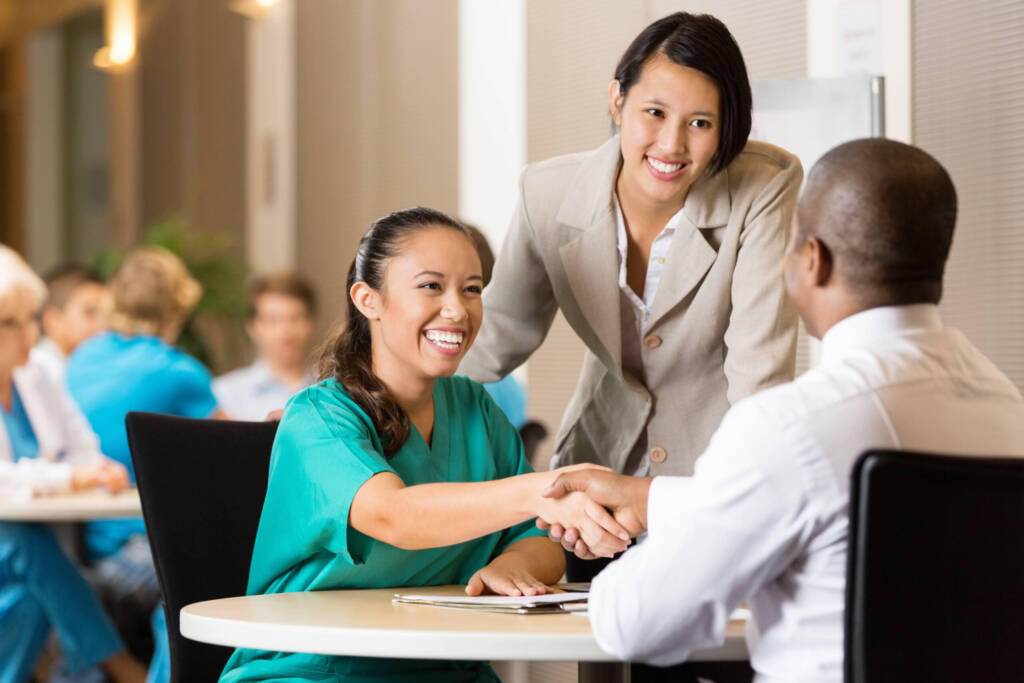 woman shaking interviewers hand