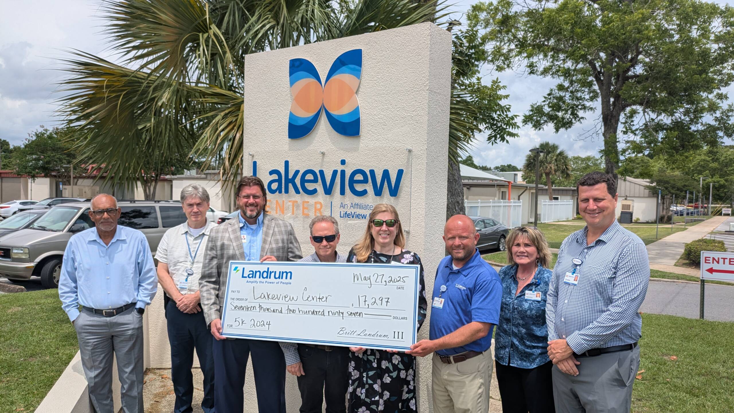 LandrumHR Public Relations Director Ildi Hosman joins Lakeview Center leaders to present a generous donation of $17,297, raised during the 2024 LandrumHR 5K.